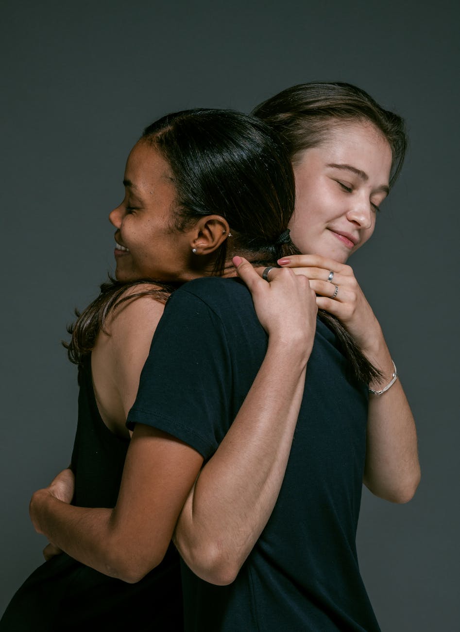 Overcome regret - happy women hugging