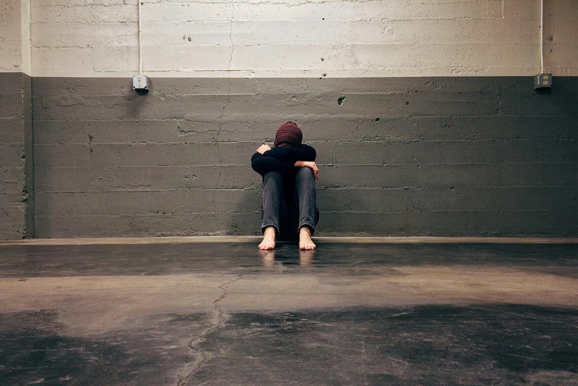 Fear - person leaning on wall